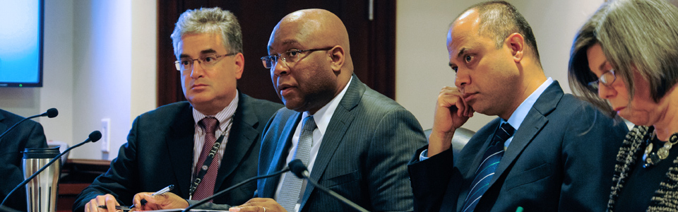 Photo showing CFTC Division Directors in a staff meeting, CFTC Washington D.C. Headquarters. Photo by Clark Day Photography.