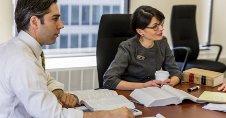 Photo showing staff in a meeting, CFTC New York Regional Office. Photo by Ken Jones Photography.
