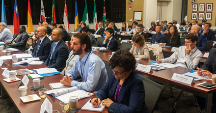 Photo showing attendees of the Commodity Futures Trading Commission annual symposium for international market authorities on regulation of derivatives products, markets, and financial intermediaries. Photo by Clark Day Photography.